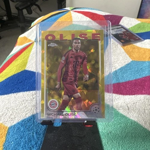 Michael Olise 2024 Panini Cromo Competiciones de Clubes UEFA Sapphire Yellow /75